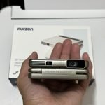 Aurzen ZIP Tri-Fold DLP Truly Mini Projector. Pocket Size. Zero-Lag Focus. One-Click Screen Mirroring. Full-Screen Mode. Type-C Fast Charging. 5.000mAh Battery. Indoor Outdoor Portable Projector.Gold photo review